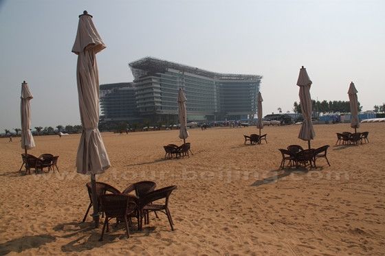 A 5 star hotel is under construction. Wicker chairs, and umbrella