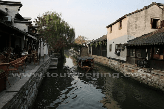 A boat is drifting on the canal