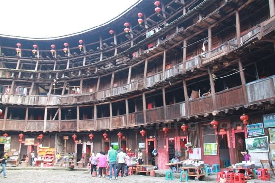 A close look at the wooden structure of the floors inside the clay building.