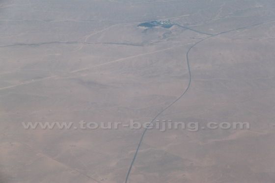 A train rail snake across the desert