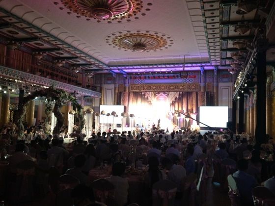 About 350 guests are attending the wedding reception.