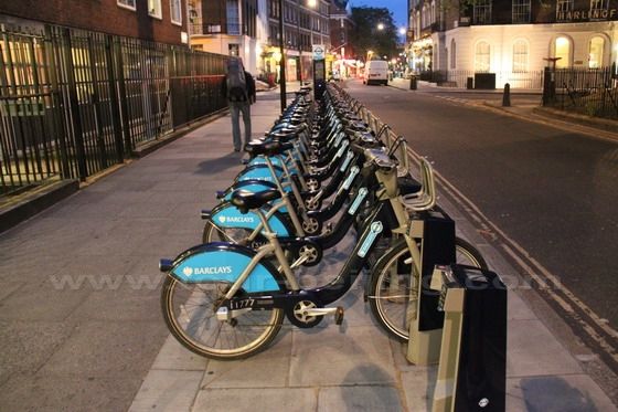 All the bicyles are in position to be hired.