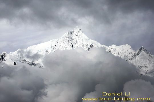 Clouds are closing in on Kawagebo Peak