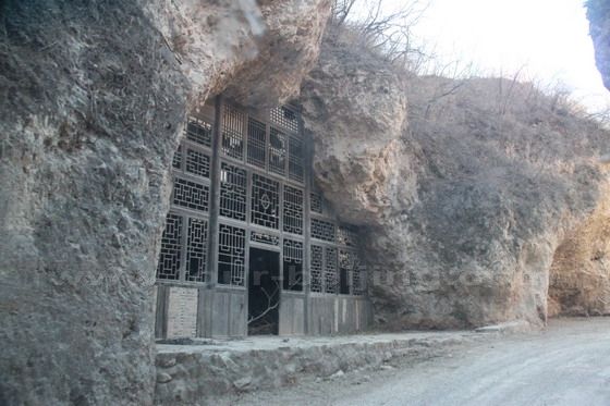 Driving by a - yaodong  - an abandoned Dwelling Cave.