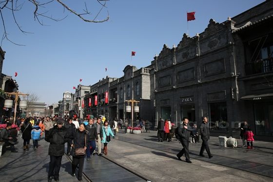 Flank ing the street are restored old buildings,  a reproduction of the old houses and building in the late Qing and the Republic era.