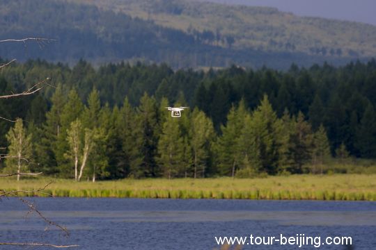 Dujuan Lake sided by the thick deciduous coniferous forests. 