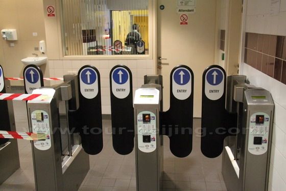 Insert the 50 pennies and enter the loo.