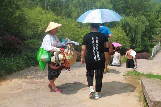 Local villagers are selling sun hats and fish baits