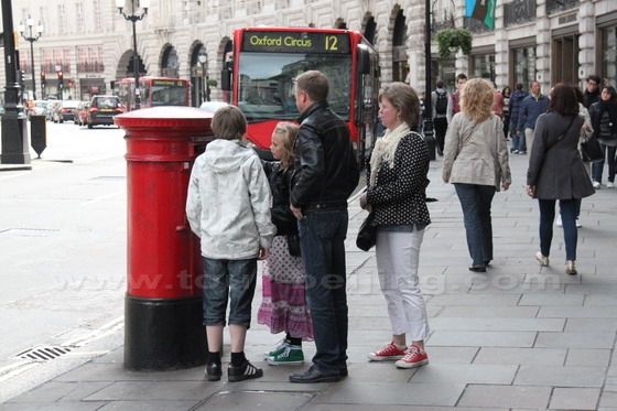 People using the Red Post Box