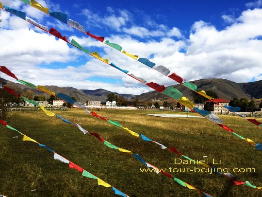 Prayer flags and Muya Village