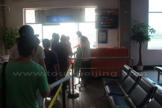 Passengers are going through the final ticket checking and leaving.