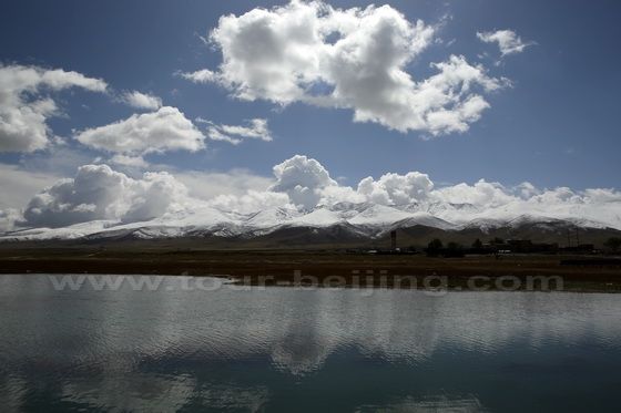 Snow capped mountains with reflections on the lake