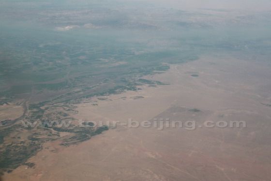 Sharply divided land - green belt and desert