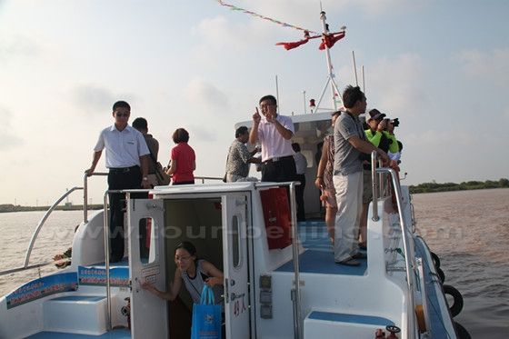 Some of our group members are out on the open deck to have a clear view of the Yellow River