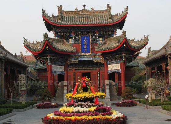The Decorated Archway with two three-legged poles supporting the Pailou. 
