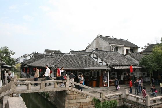 The beam bridge is across the river.