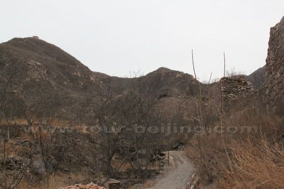 The city wall in the south of the fort village, you still can see the remaining wall and the lonely watch tower perched on the hilltop above the village.