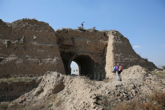 The dilapidated east gate coated with bricks and stones.