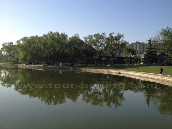 The green belt and stone paved pathway circles the lake