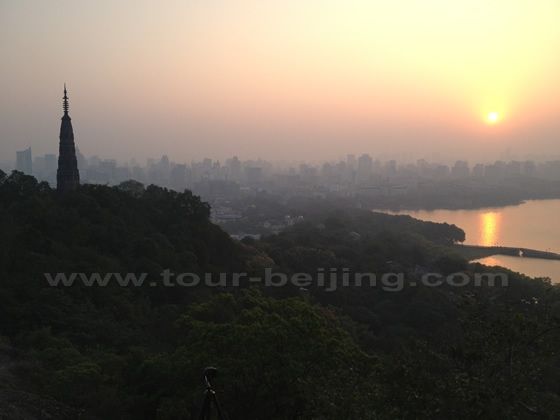 The slender Baoshu Pagoda is competing the beauty of the bright rising sun.