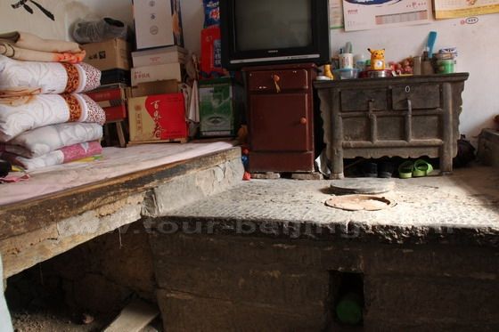 The stone kang beds in the house. 