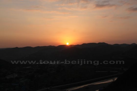 The total sun is over the mountains