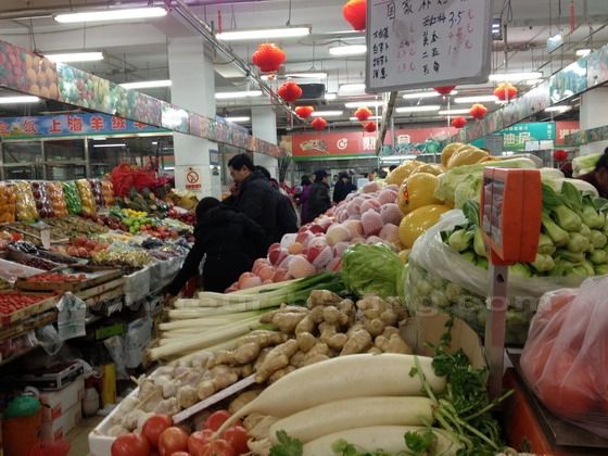 The whole market is piled up with various kinds of vegetable and fruits