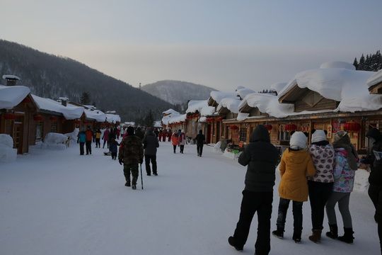 Walking in the main street in Snow Village under the sunrise glow.