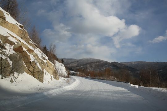 We are driving up along the zigzag mountain road.