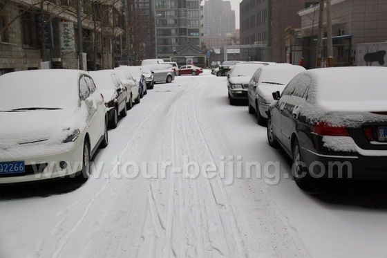 White blanketed cars parking outside our residential area.