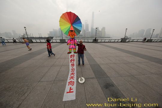 Proudly showing his kite.