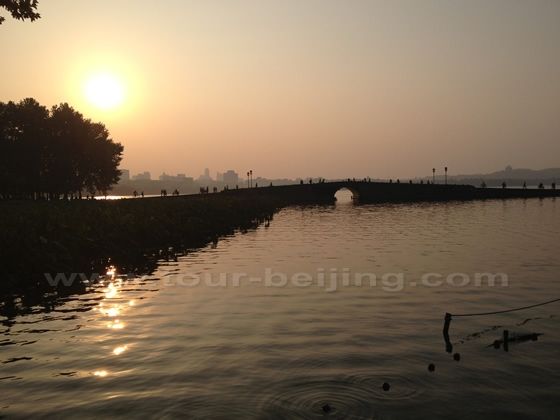 the rising sun over the Broken Bridge