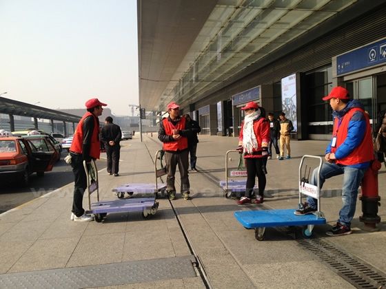 the porters from Red Cap Service are waiting for business